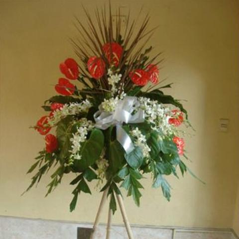Orange anthurium with orchids